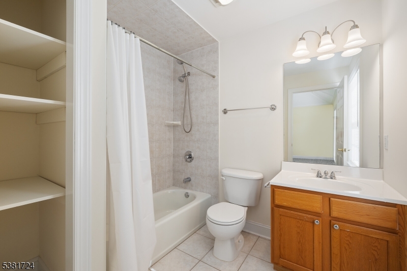 737 Jerusalem Road, Unit 2 Scotch Plains, NJ 07076 - Photo 25 of 32 a bathroom with a sink a toilet and shower