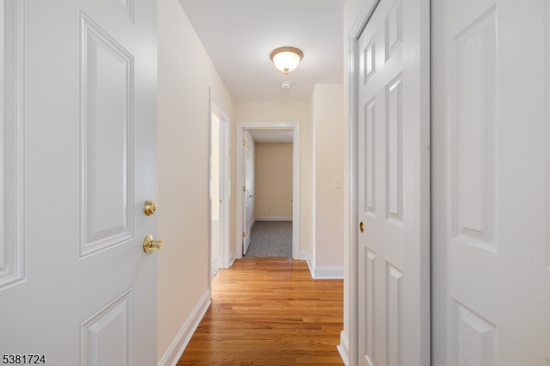 737 Jerusalem Road, Unit 2 Scotch Plains, NJ 07076 - Photo 8 of 32 a view of a hallway with a livingroom and a bathroom
