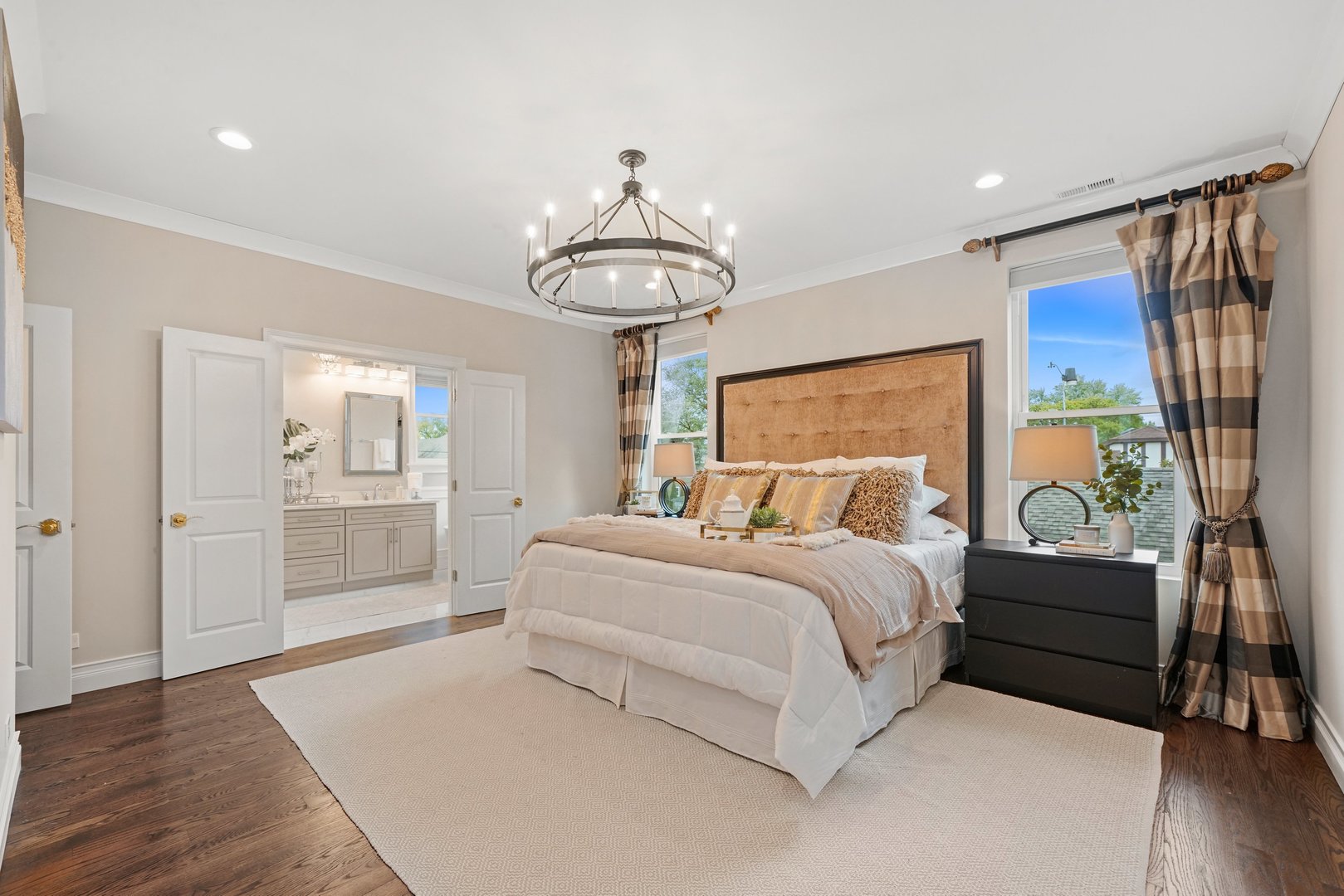 329 South Delphia Avenue Park Ridge, IL 60068 - Photo 13 of 25 a bedroom with a large bed and a chandelier