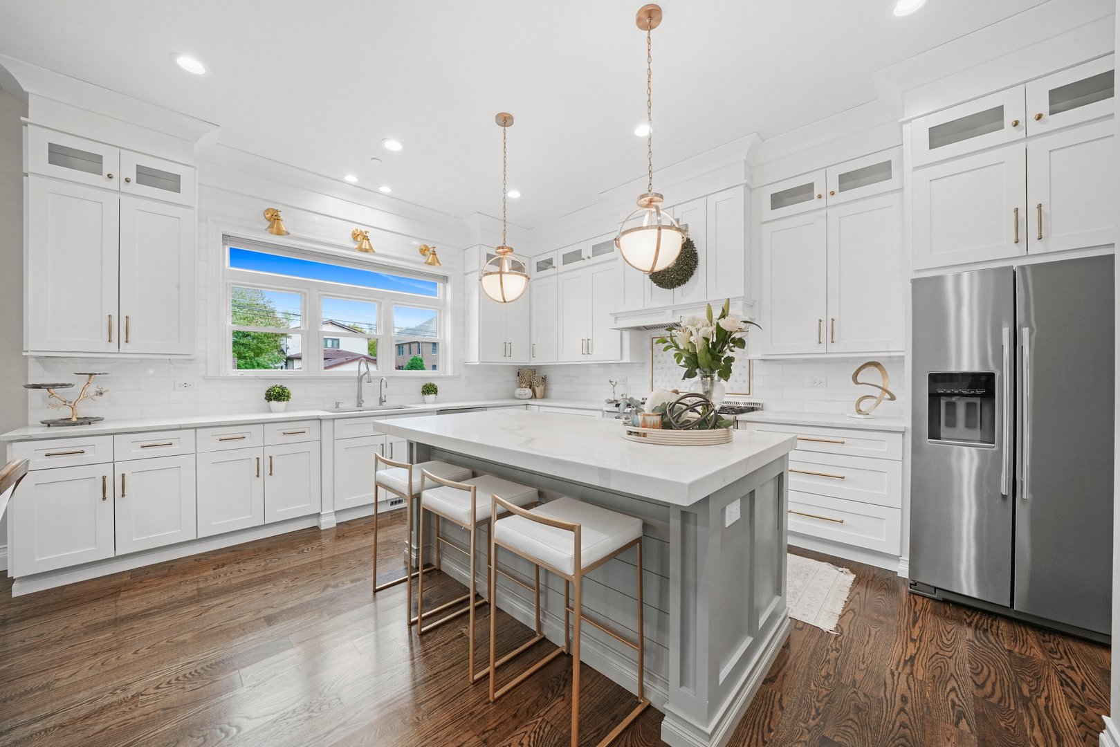 329 South Delphia Avenue Park Ridge, IL 60068 - Photo 6 of 25 a kitchen with white cabinets stainless steel appliances and wooden floor
