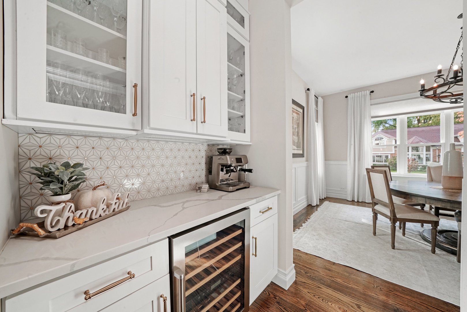 329 South Delphia Avenue Park Ridge, IL 60068 - Photo 8 of 25 a kitchen with stainless steel appliances white cabinets and wooden floor
