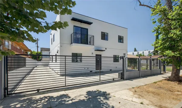 a view of a brick house with a large window
