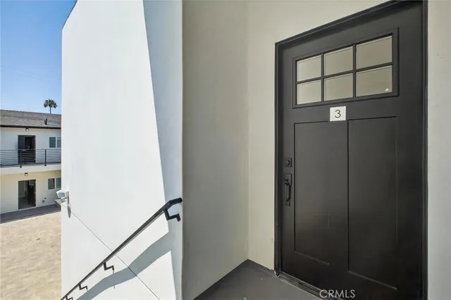 a kitchen with stainless steel appliances granite countertop a sink a refrigerator and a stove