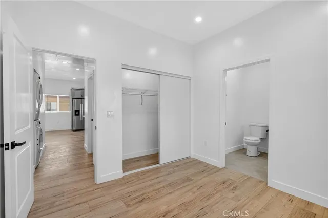 a view of a room with wooden floor