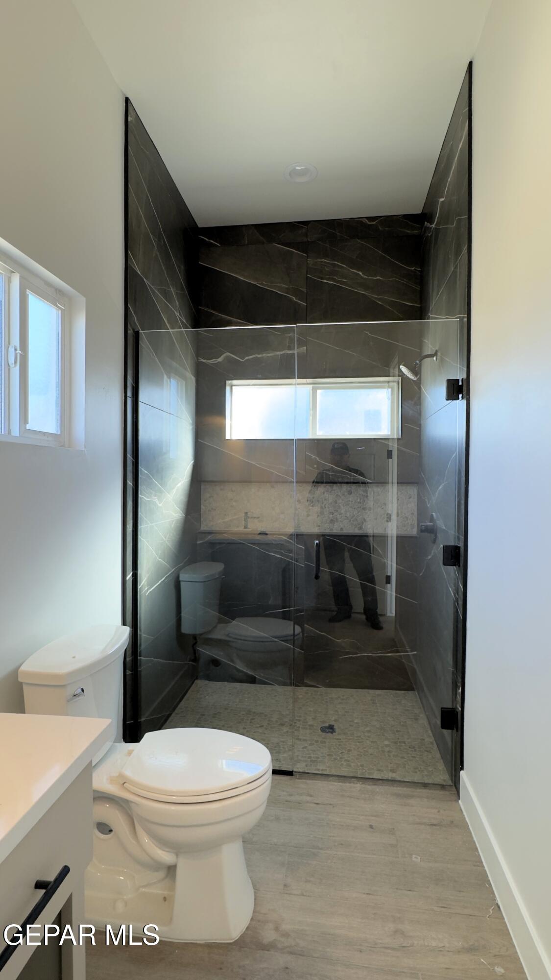 5656 Rio Bonito Circle El Paso, TX 79932 - Photo 14 of 36 a bathroom with a toilet and a shower