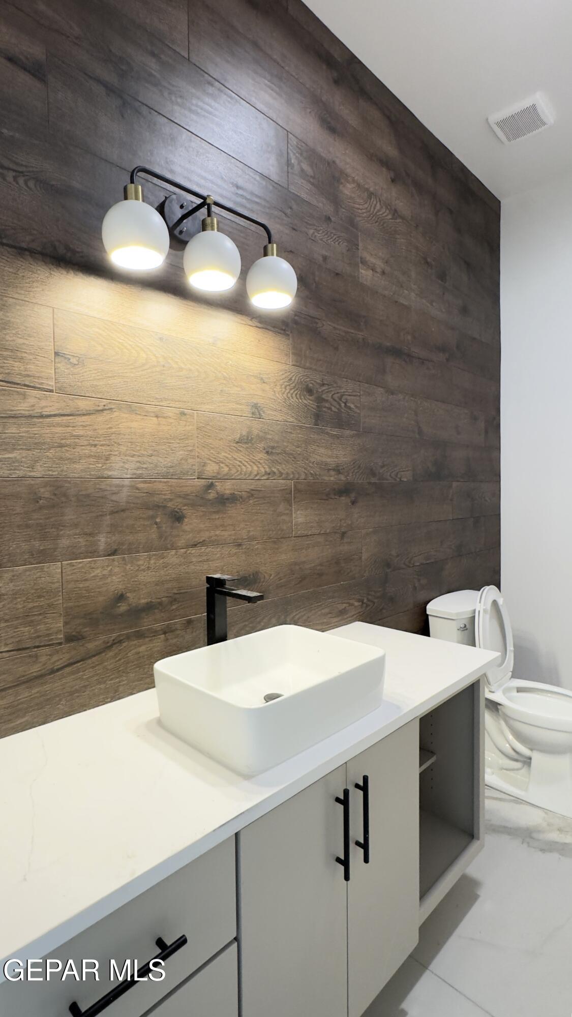5656 Rio Bonito Circle El Paso, TX 79932 - Photo 28 of 36 a bathroom with a sink and a mirror