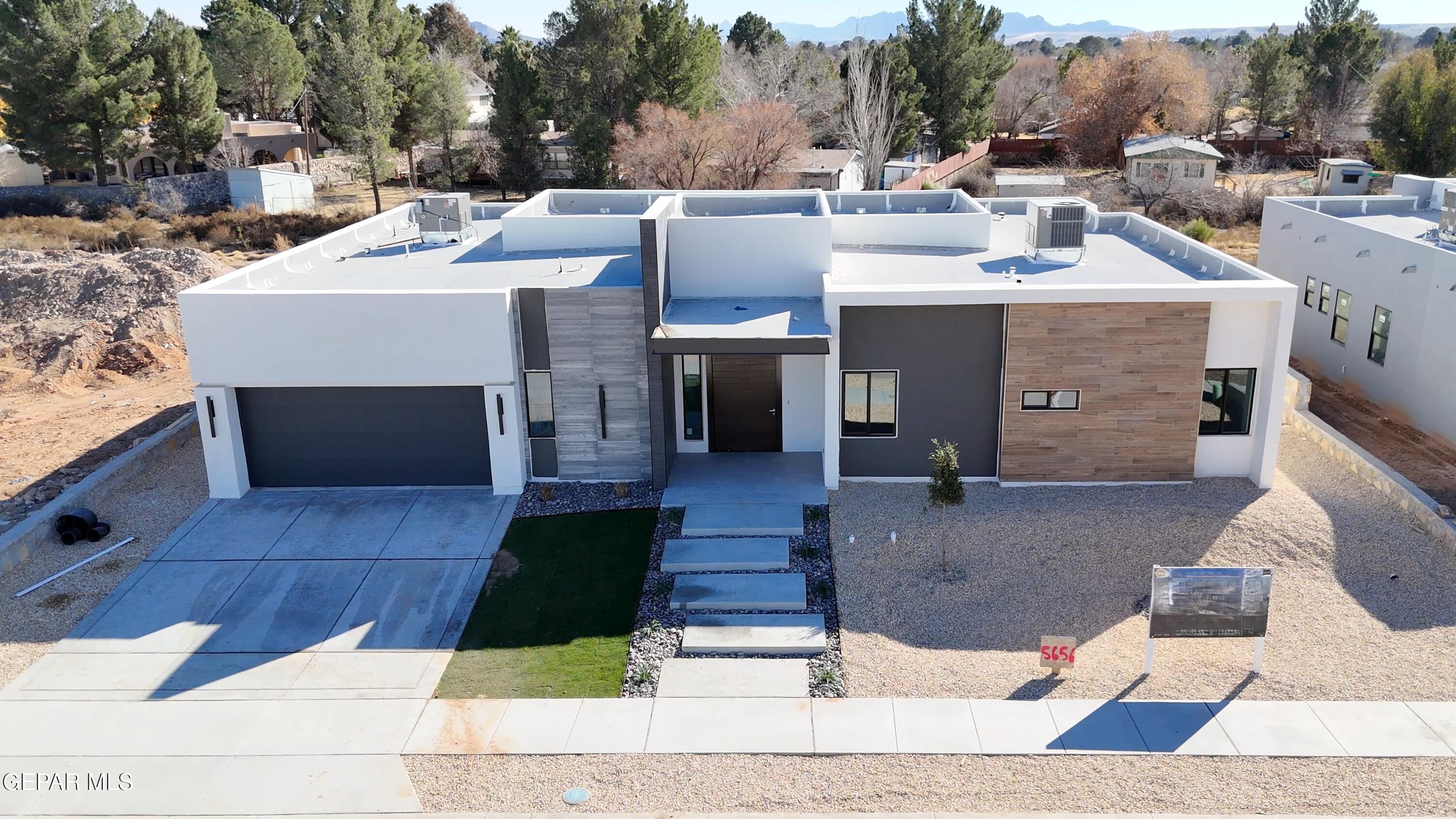 5656 Rio Bonito Circle El Paso, TX 79932 - Photo 3 of 36 a view of a patio with table and chairs couches fire pit and a barbeque