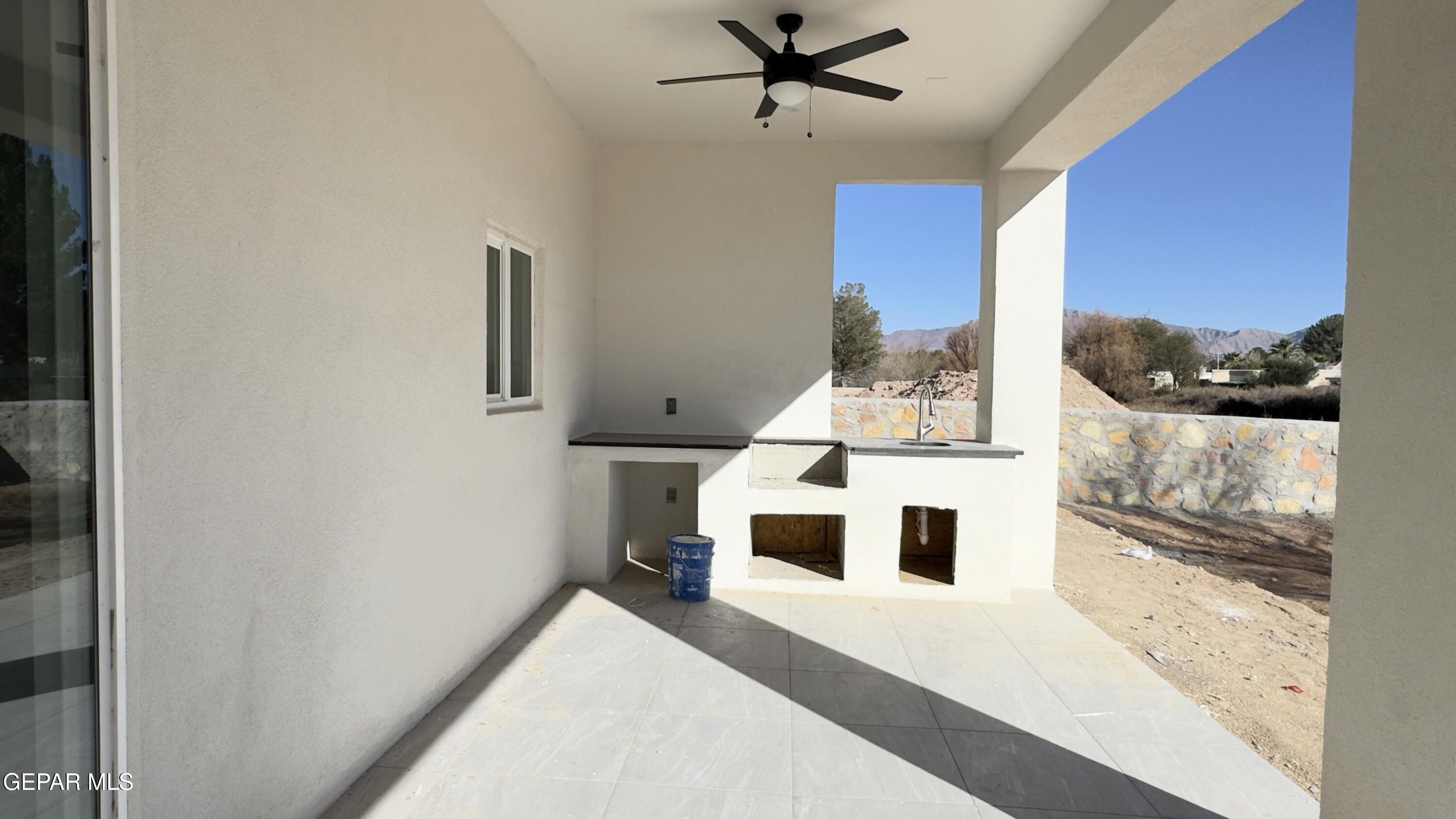 5656 Rio Bonito Circle El Paso, TX 79932 - Photo 32 of 36 a living room with a bed furniture and a window