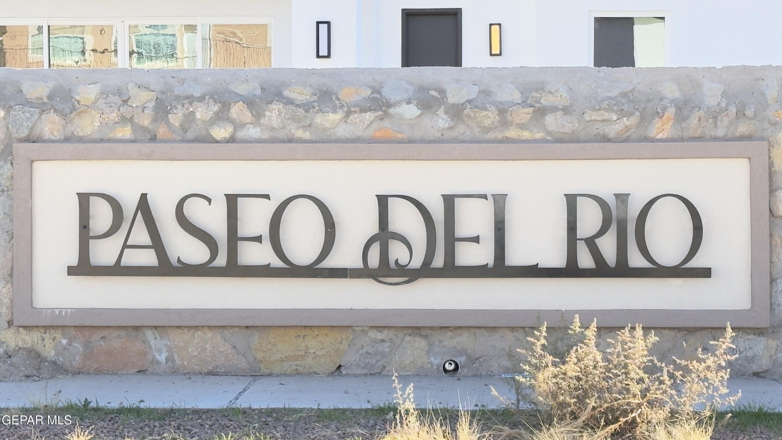 5656 Rio Bonito Circle El Paso, TX 79932 - Photo 36 of 36 a white wall with a black white and white wooden cabinets