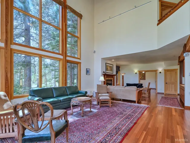 a living room with furniture and a rug