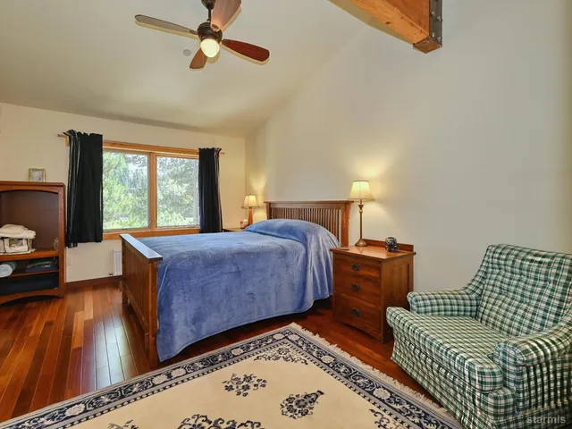 a bedroom with a bed and window