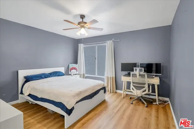 a bedroom with a bed and a table in it