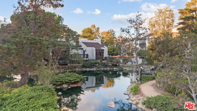 a house with river in front of it