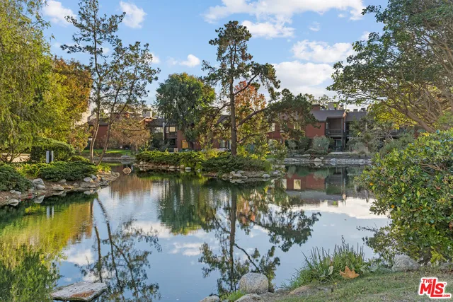 a view of a lake with a building in the background