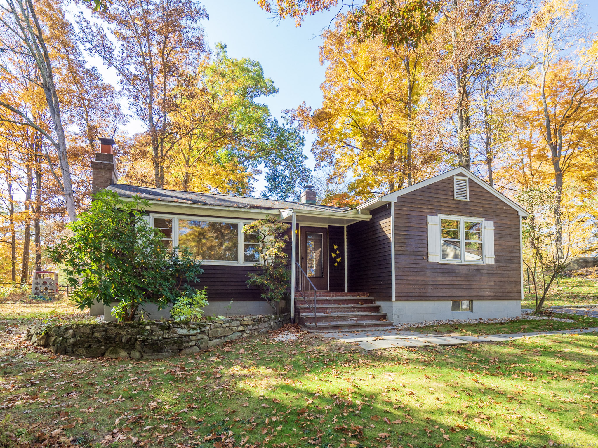 27 Woodland Way Ridgefield, CT 06877 - Photo 1 of 18 a view of a house with a yard
