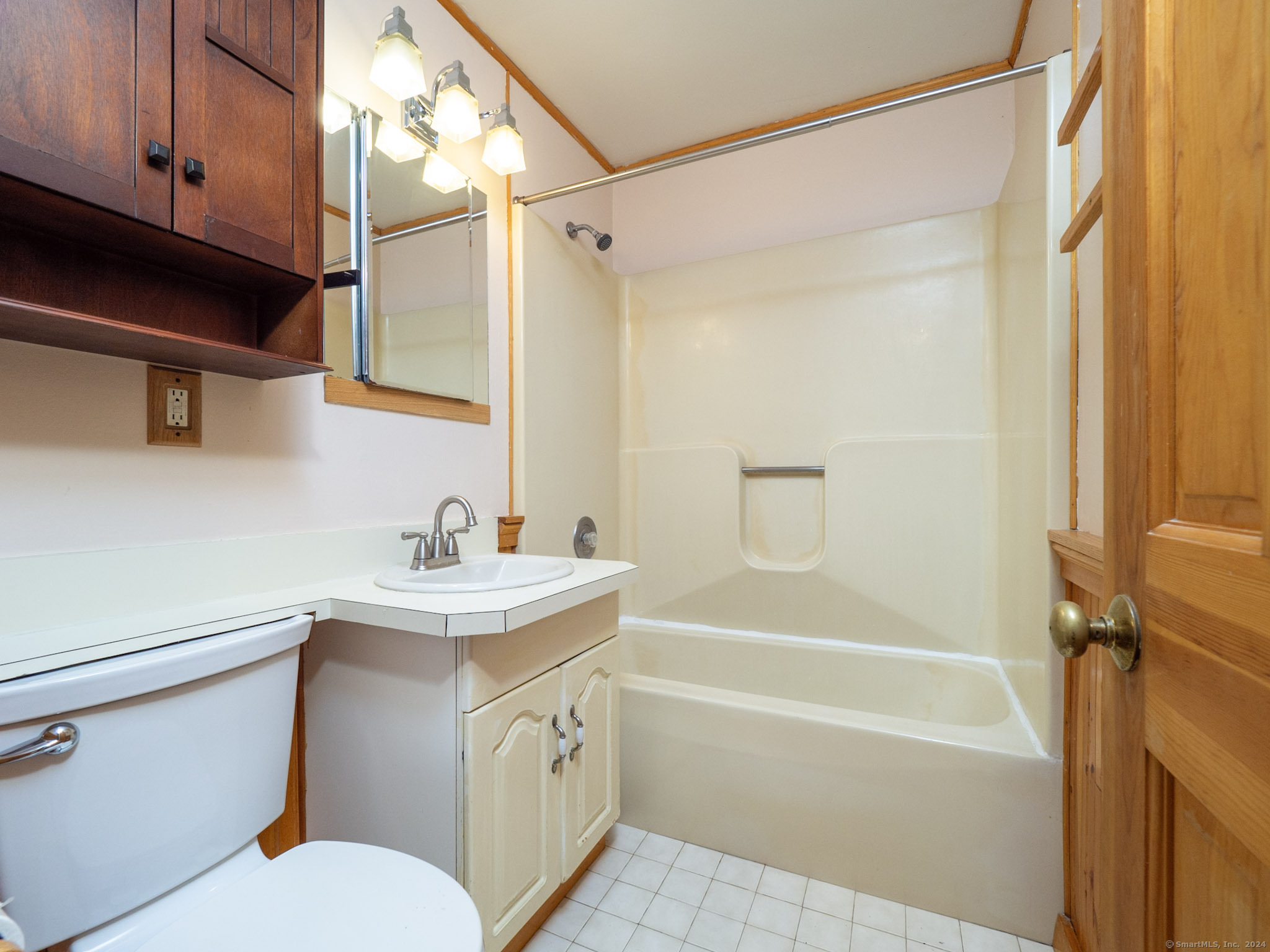 27 Woodland Way Ridgefield, CT 06877 - Photo 12 of 18 a bathroom with a sink a toilet and shower