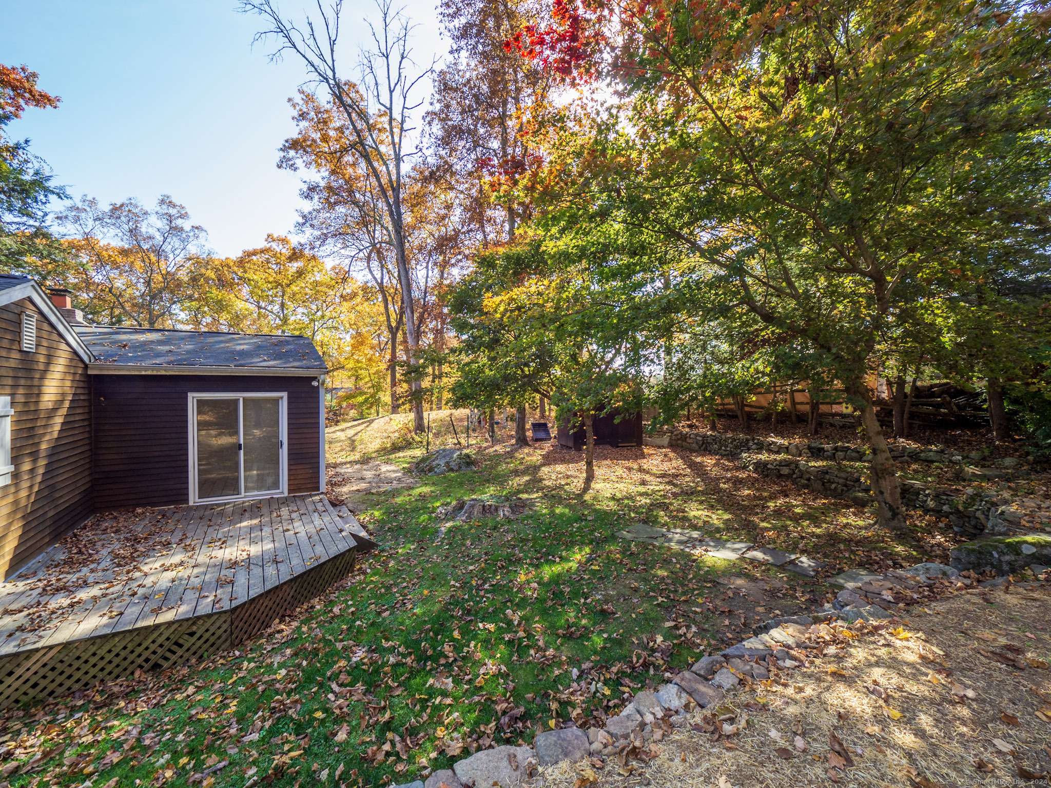 27 Woodland Way Ridgefield, CT 06877 - Photo 14 of 18 a front view of a house with a tree