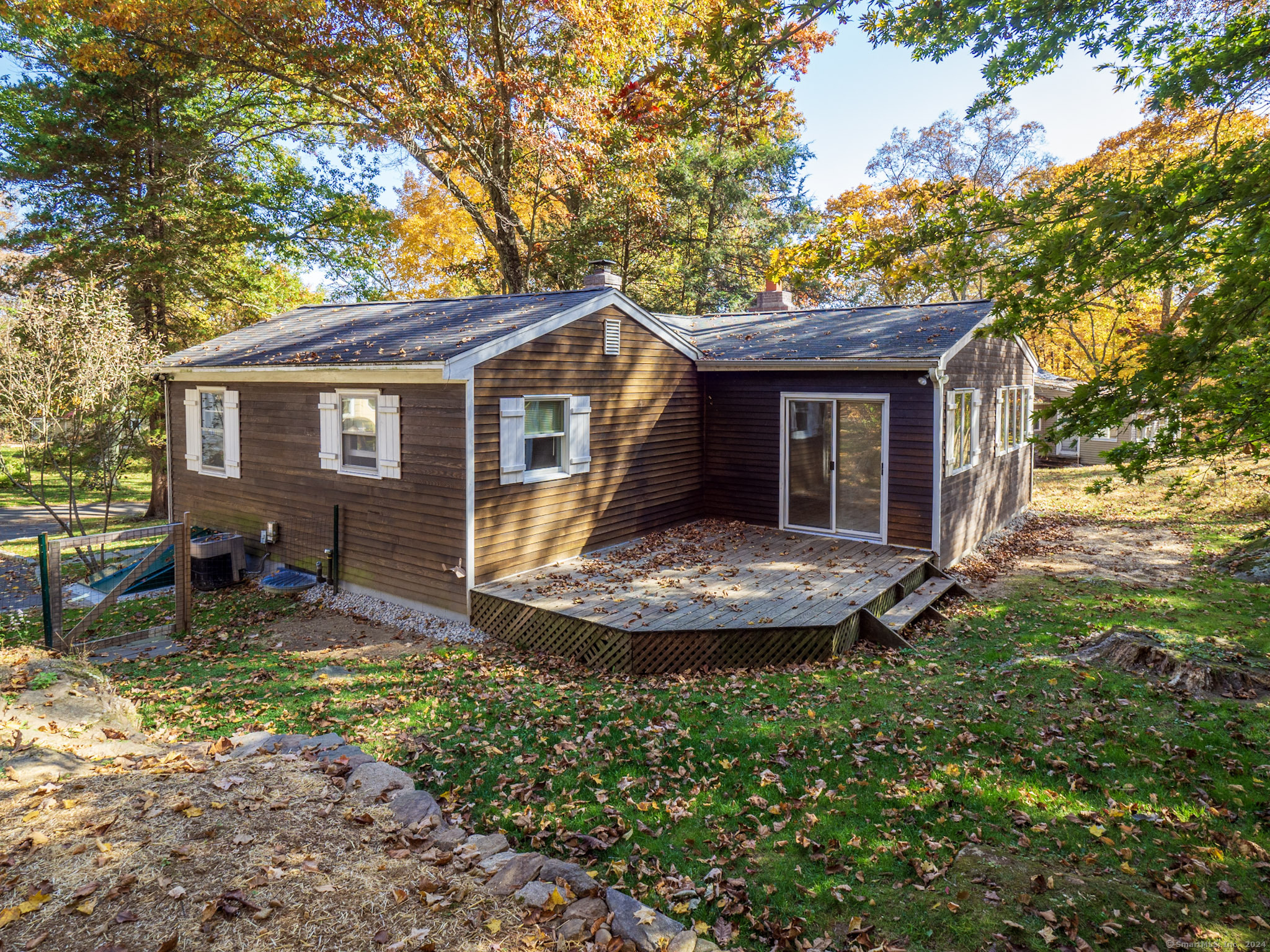 27 Woodland Way Ridgefield, CT 06877 - Photo 15 of 18 a view of a house with backyard and sitting area