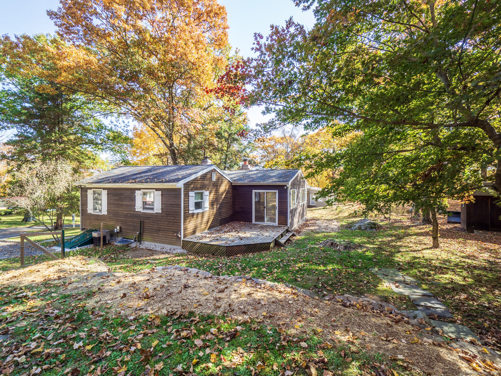 27 Woodland Way Ridgefield, CT 06877 - Photo 16 of 18 a house that has a tree in front of it