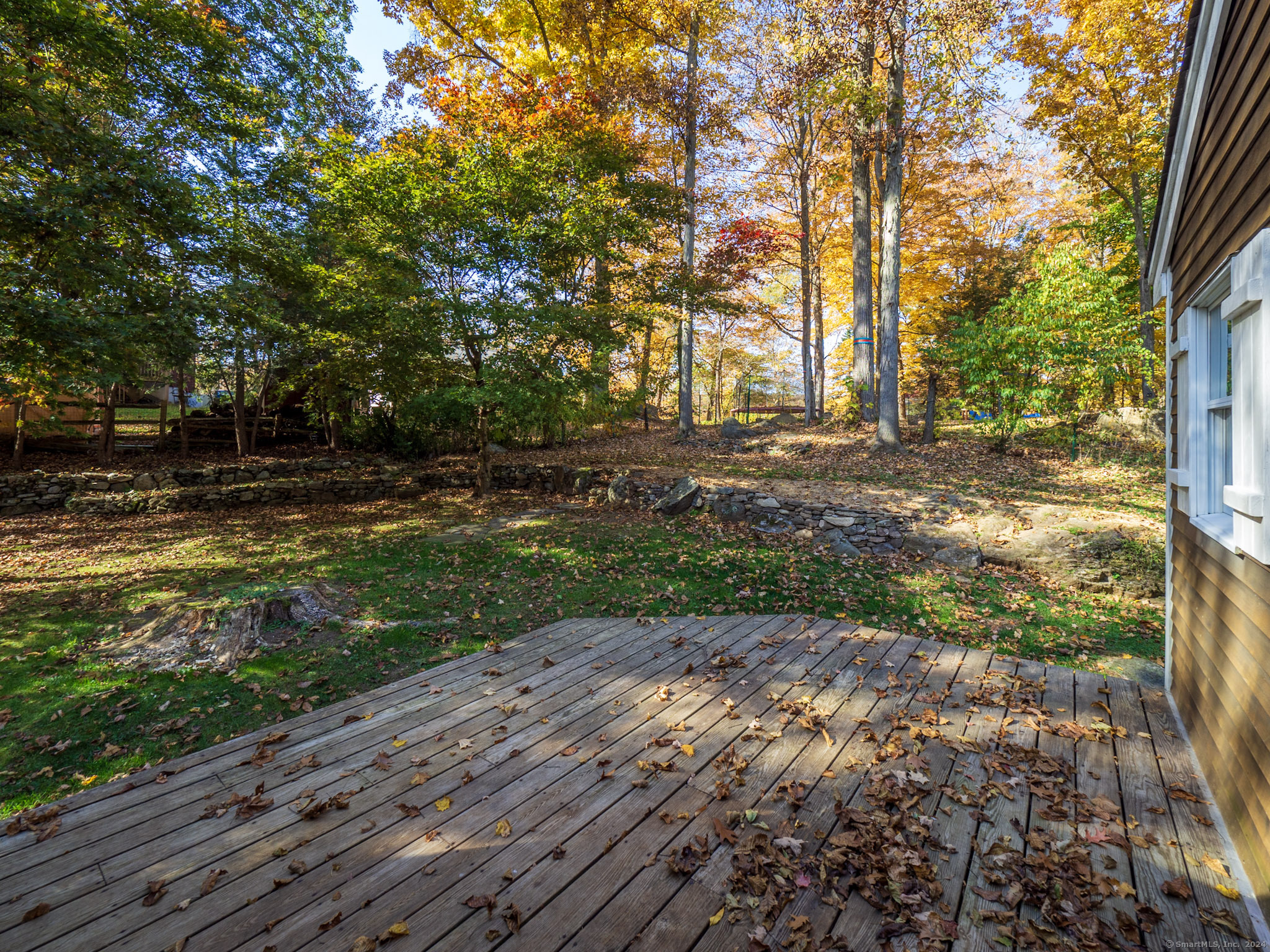 27 Woodland Way Ridgefield, CT 06877 - Photo 17 of 18 a view of a yard with plants and trees