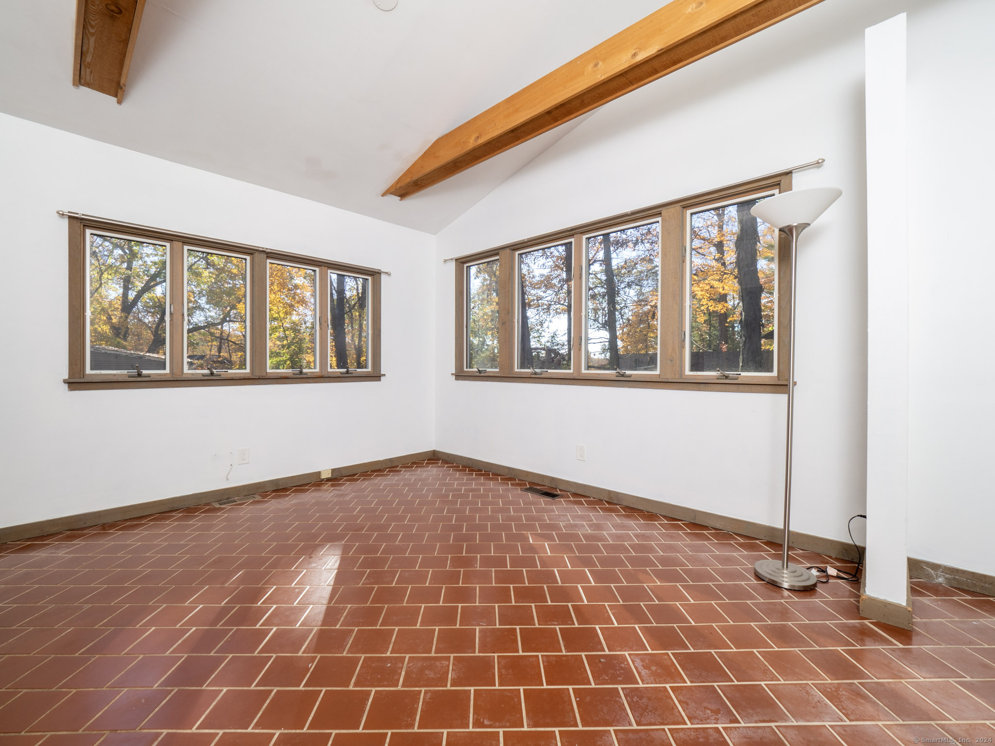27 Woodland Way Ridgefield, CT 06877 - Photo 6 of 18 a view of an empty room with a window