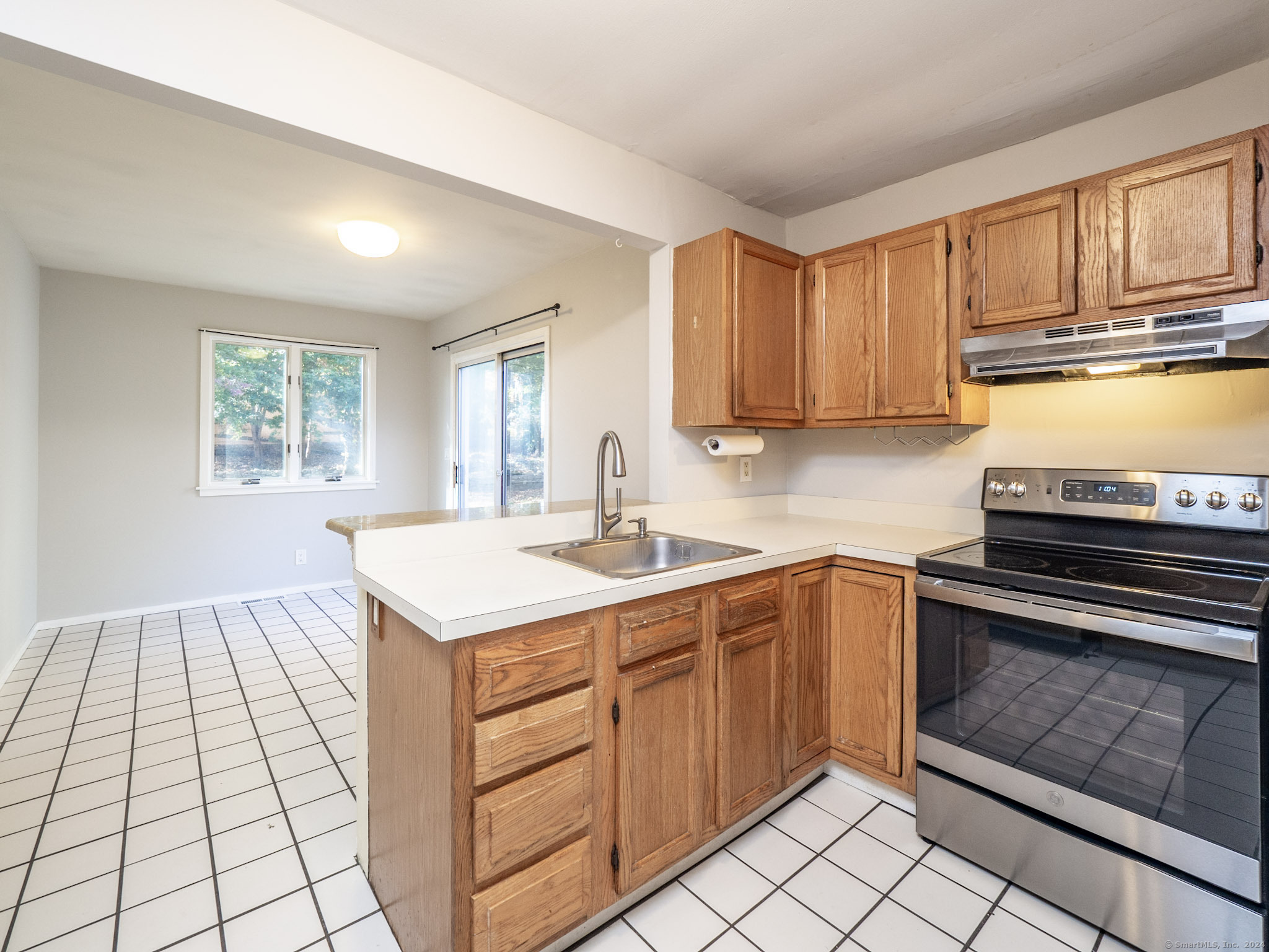 27 Woodland Way Ridgefield, CT 06877 - Photo 8 of 18 a kitchen with a sink stove and cabinets
