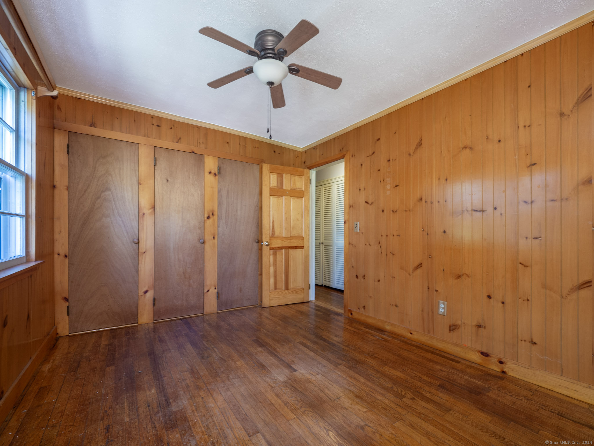 27 Woodland Way Ridgefield, CT 06877 - Photo 10 of 18 wooden floor in an empty room
