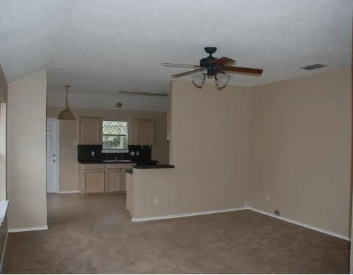a kitchen with a refrigerator and a sink