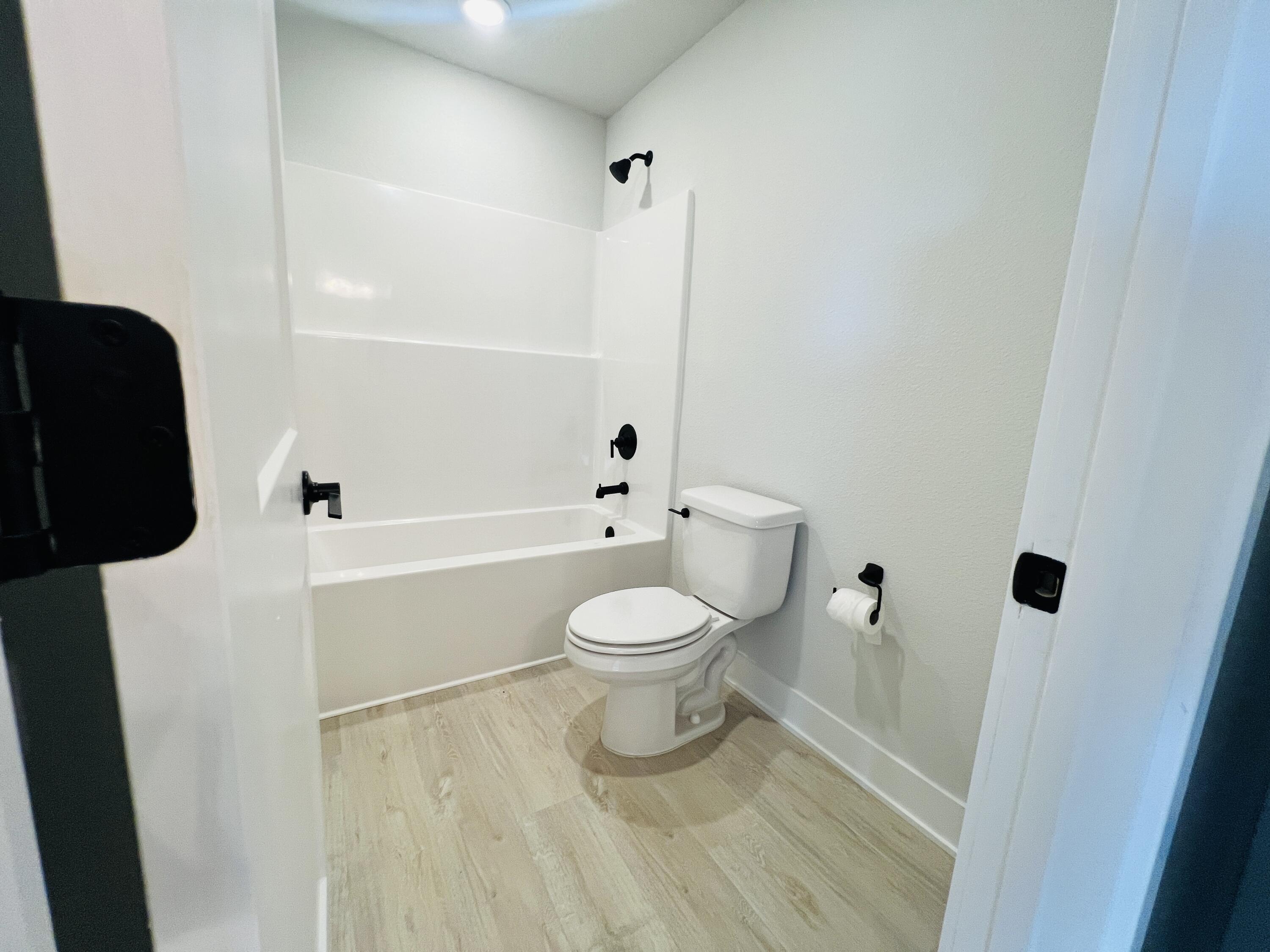 5303 Hidden Pines Circle Milton, FL 32583 - Photo 21 of 22 a bathroom with a toilet and a shower