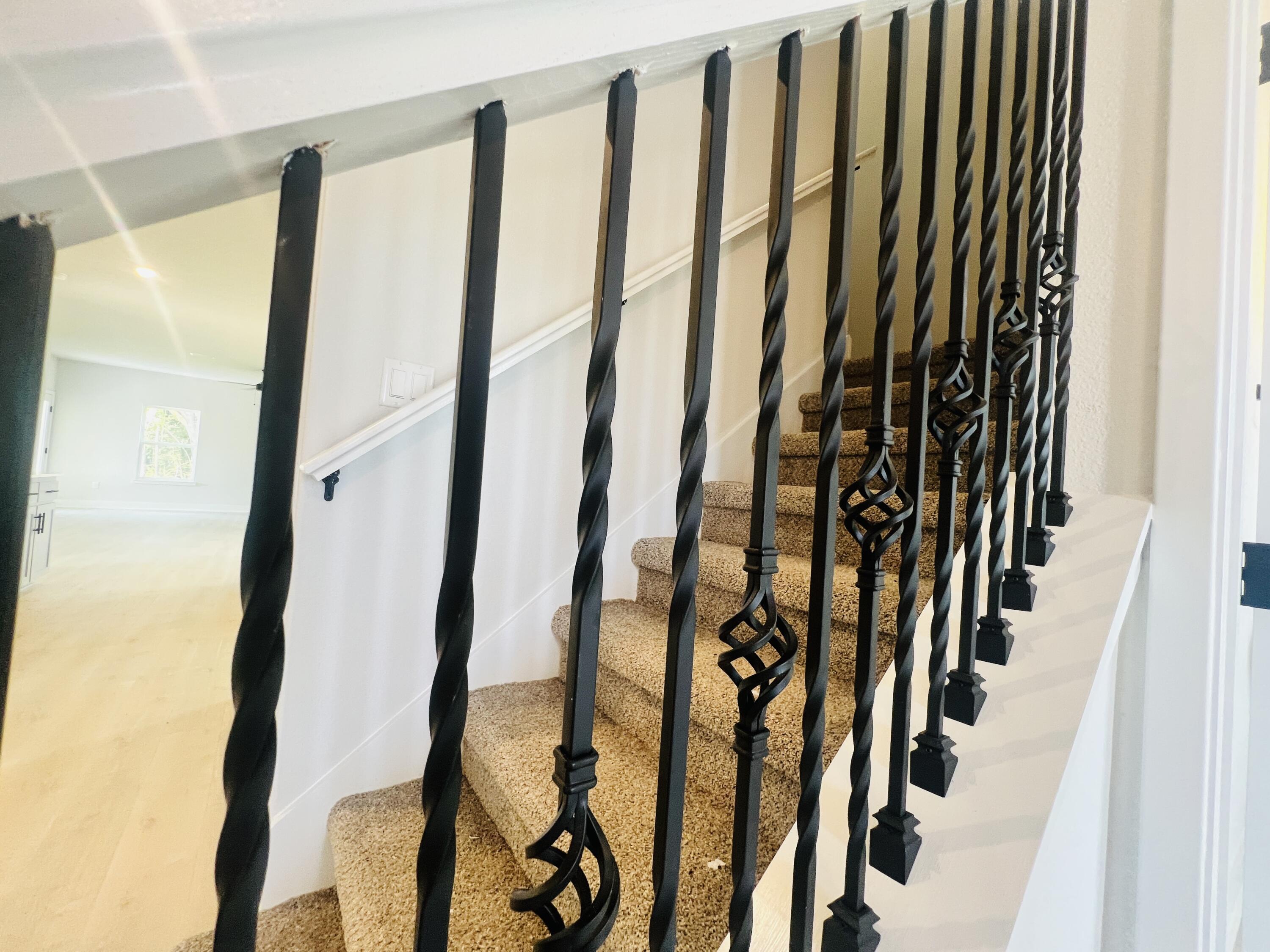 5303 Hidden Pines Circle Milton, FL 32583 - Photo 6 of 22 a view of staircase with railing and white walls