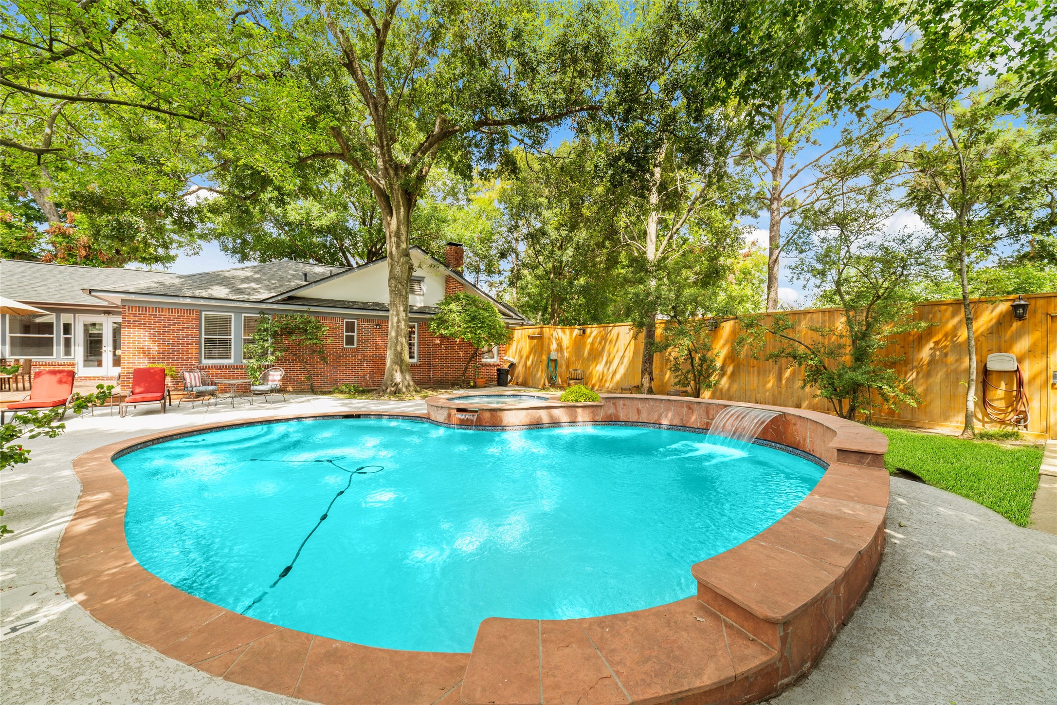 1613 California Street Houston, TX 77006 - Photo 1 of 50 Tucked beneath a canopy of mature trees on a rare double lot in the heart of Cherryhurst in Montrose, this heated saltwater pool and spa create a private retreat that feels worlds away from the city, yet just steps from everything that makes the neighborhood so special.