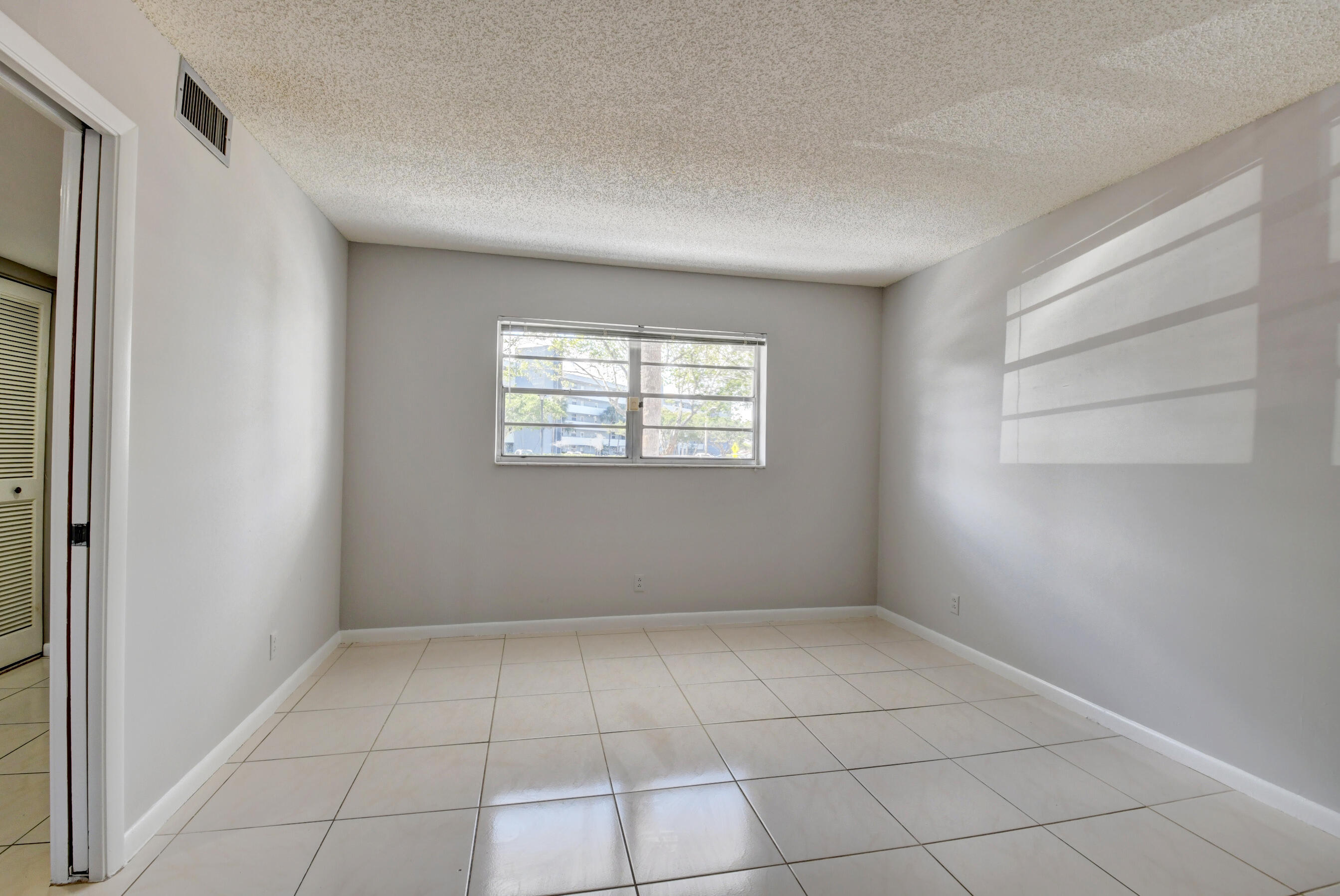 6500 Northwest 2nd Avenue, Unit 111 Boca Raton, FL 33487 - Photo 15 of 23 Guest Bedroom