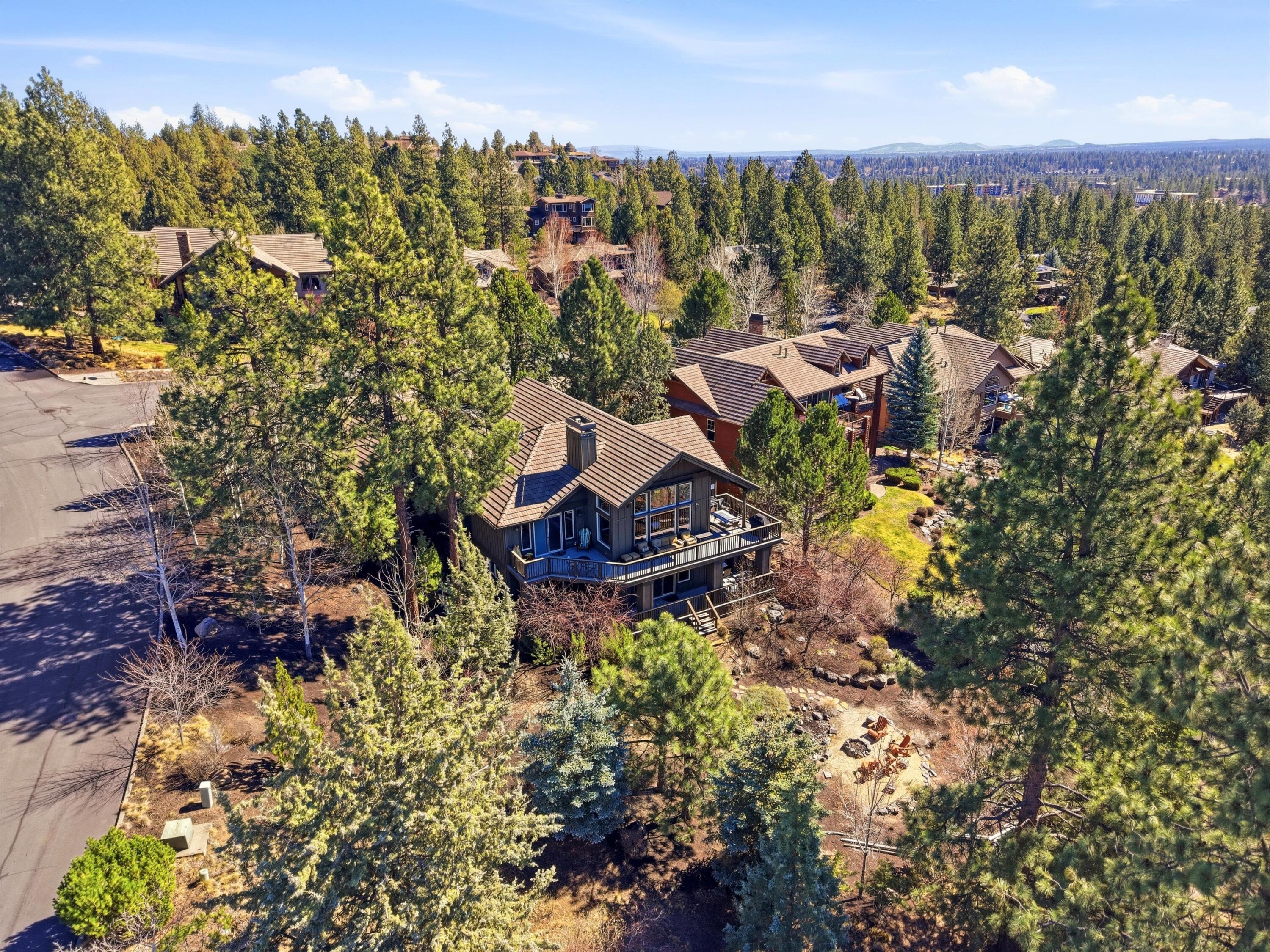 15 Southwest Quail Butte Place Bend, OR 97703 - Photo 2 of 55 a view of a lake in middle of forest