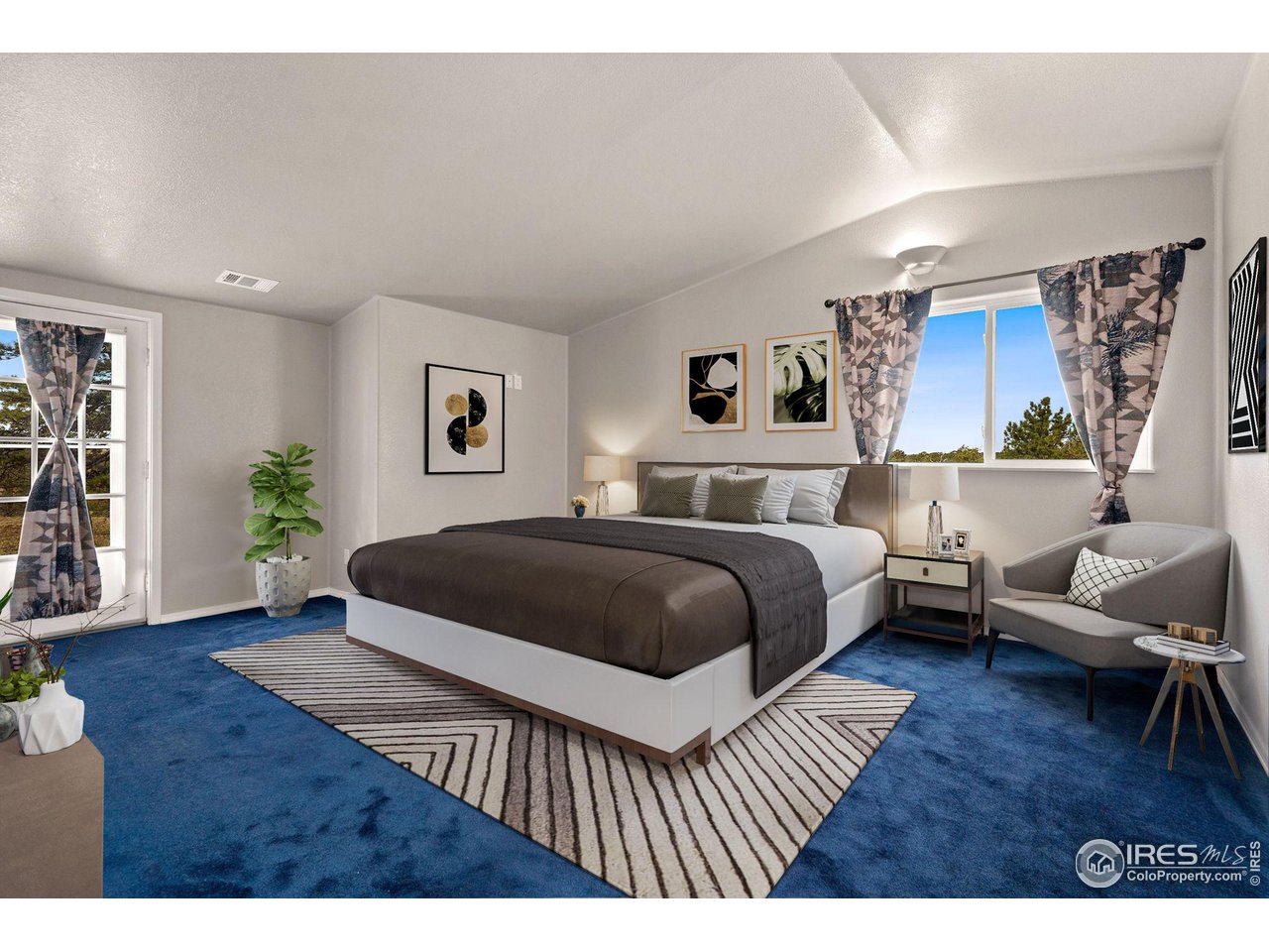 7770 Red Mountain Road Livermore, CO 80536 - Photo 12 of 36 a bedroom with a large bed and a couch