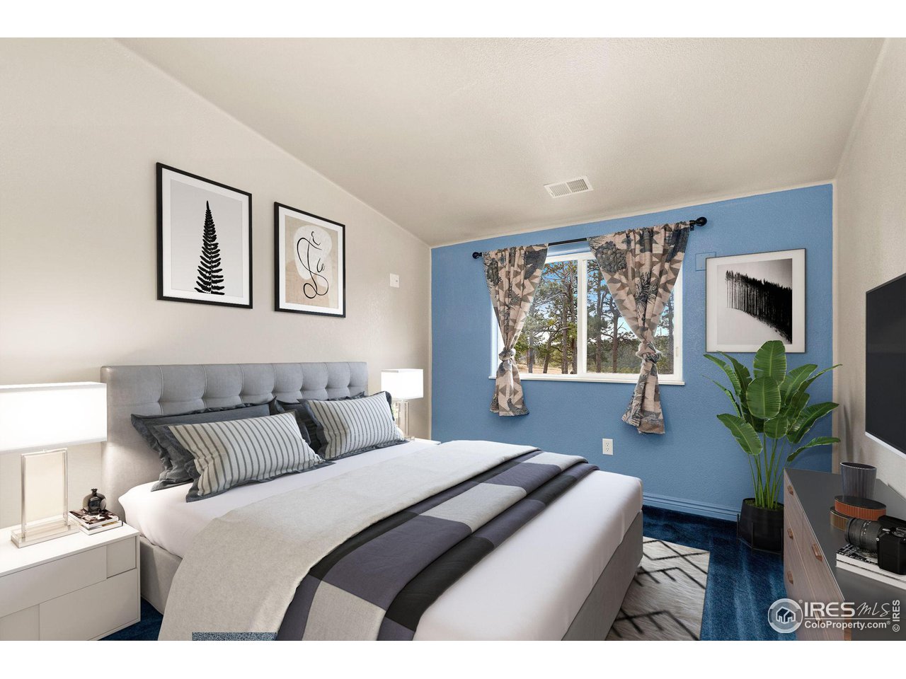 7770 Red Mountain Road Livermore, CO 80536 - Photo 16 of 36 a bedroom with a large bed and a window