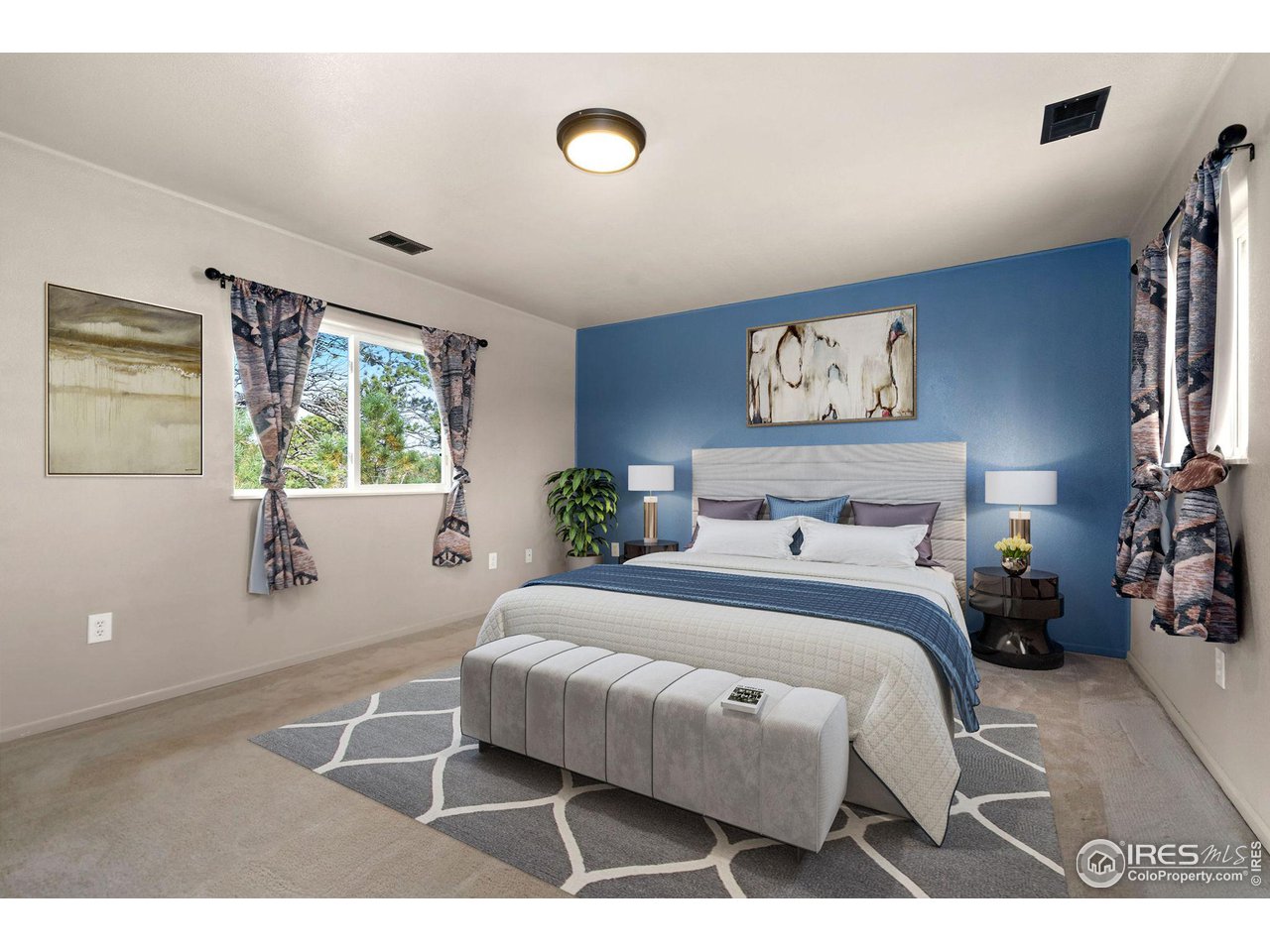 7770 Red Mountain Road Livermore, CO 80536 - Photo 19 of 36 a bedroom with a bed a couch and a window