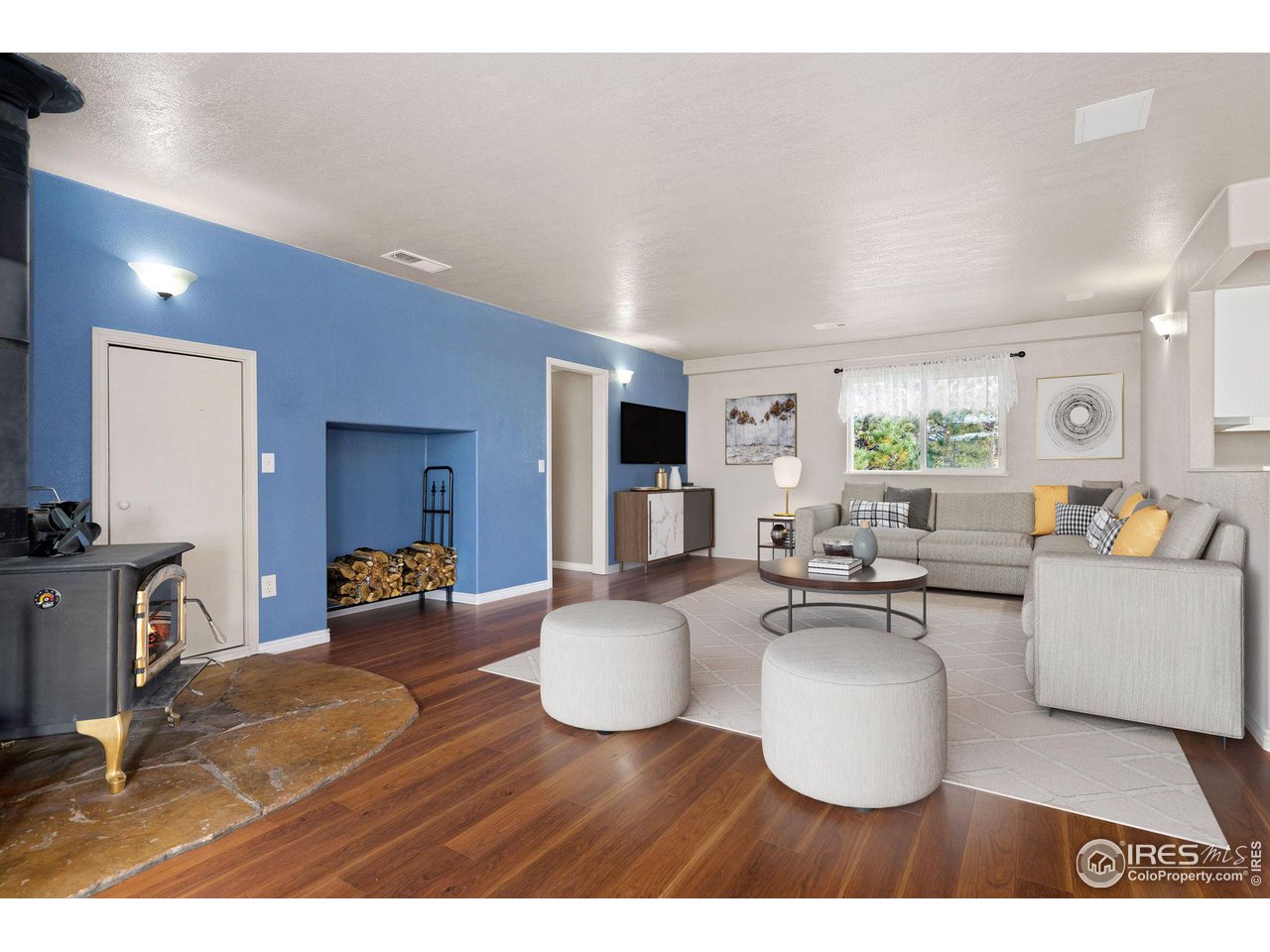 7770 Red Mountain Road Livermore, CO 80536 - Photo 5 of 36 a living room with furniture and a flat screen tv