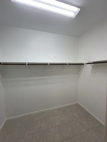 a view of an empty walk in closet
