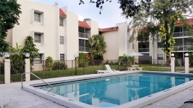 a view of outdoor kitchen and swimming pool