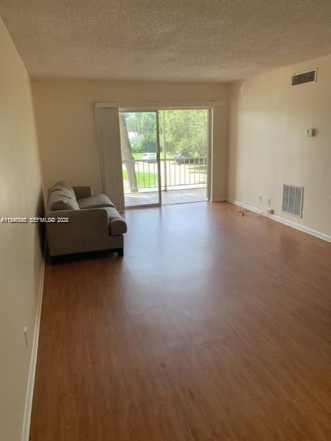 632 Northwest 13th Street, Unit 230 Boca Raton, FL 33486 - Photo 3 of 12 a living room with furniture and a large window