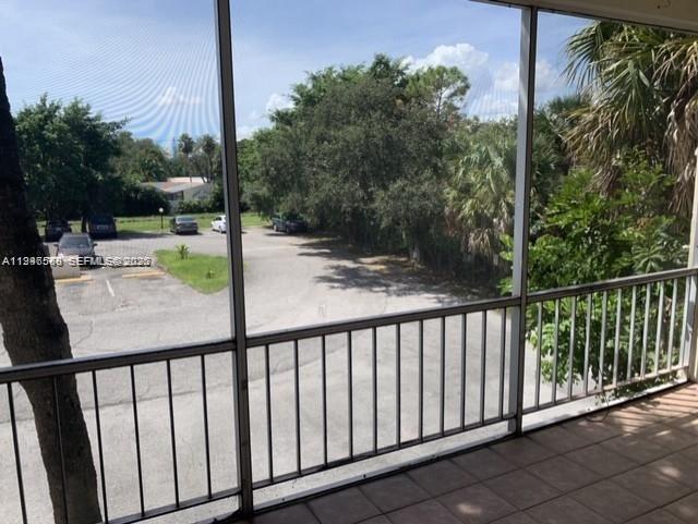 632 Northwest 13th Street, Unit 230 Boca Raton, FL 33486 - Photo 6 of 12 a view of a balcony with yard