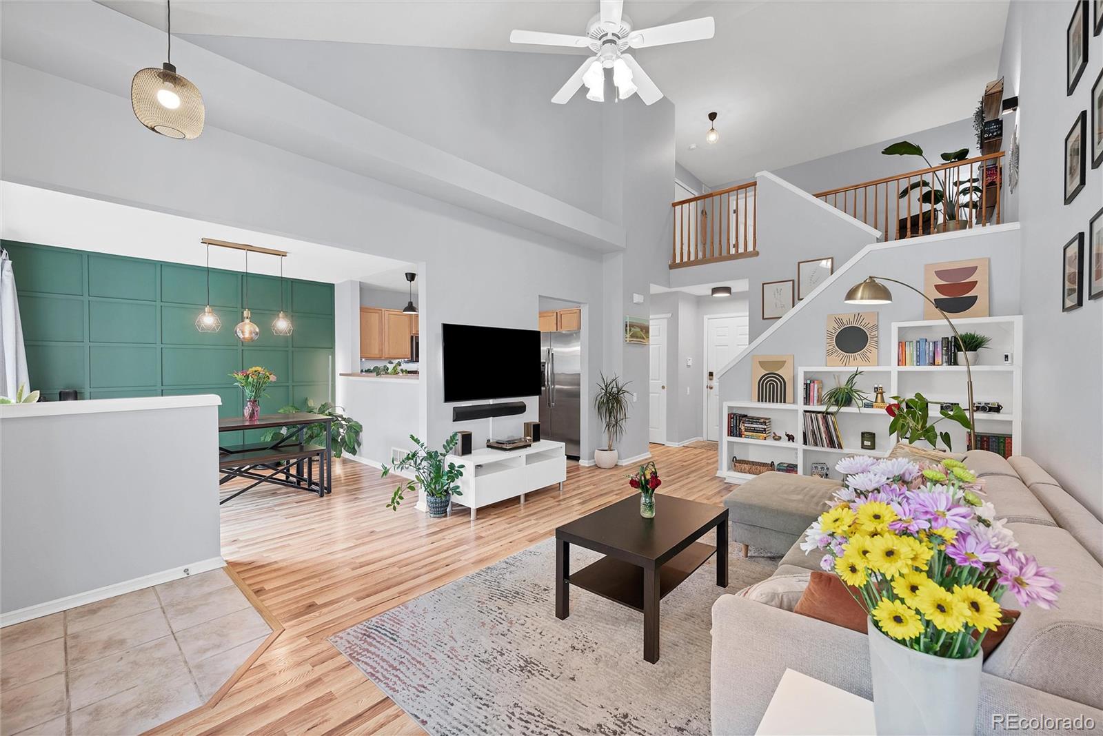 893 South Evanston Circle Aurora, CO 80012 - Photo 4 of 28 a living room with furniture and a flat screen tv