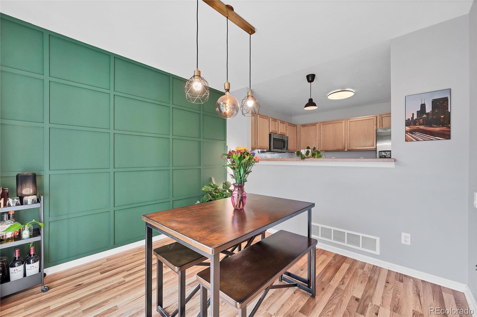 893 South Evanston Circle Aurora, CO 80012 - Photo 8 of 28 a view of a dining room with a table and chairs