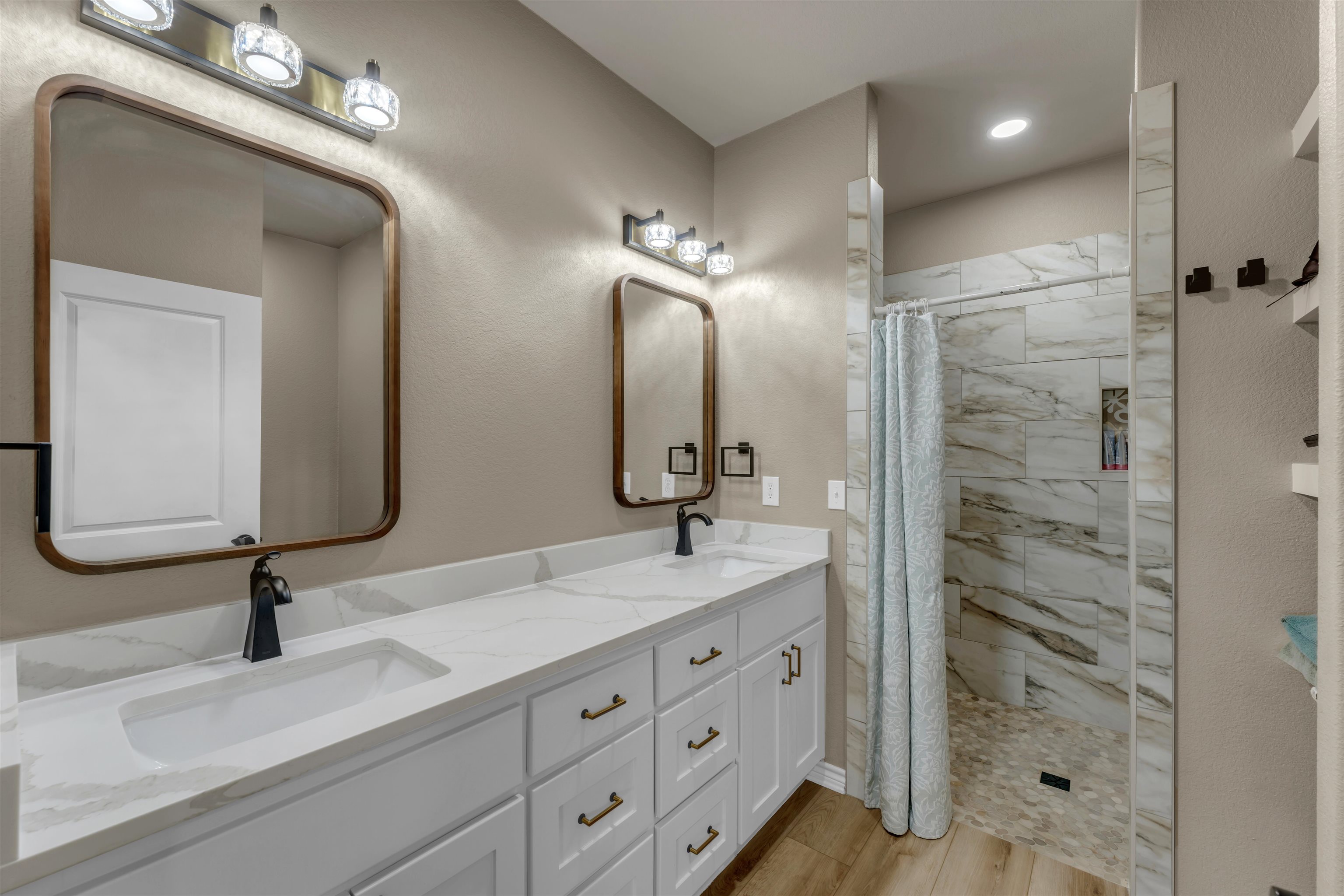 494 Johnson Road Mason, TX 76856 - Photo 20 of 28 a bathroom with double vanity and a mirror