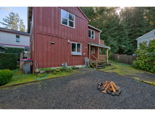 a backyard of a house with wooden fence