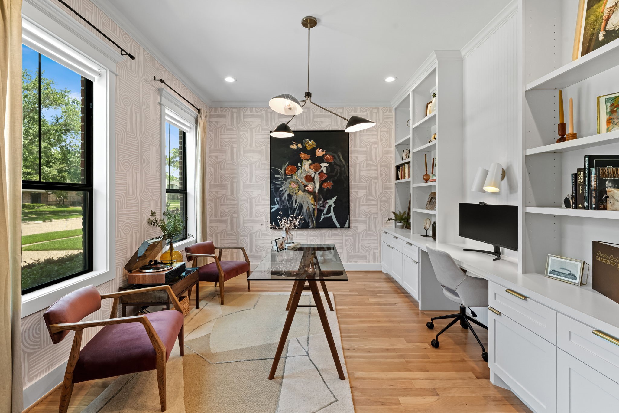 1013 Martin Street Houston, TX 77018 - Photo 7 of 46 Beautiful private study tucked behind iron French doors featuring extensive custom built-ins, desk space, decorative wallpaper, drapes, & Hunter Douglas shades. Sophisticated yet highly functional work-from-home space.
