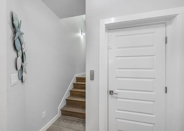 a view of staircase with white walls