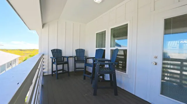 a view of a dining room with furniture and window