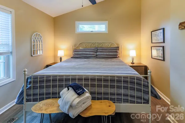 a bedroom with a bed and window