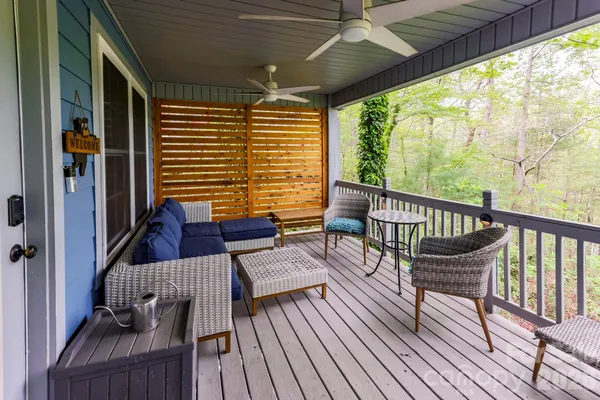 a view of a balcony with furniture